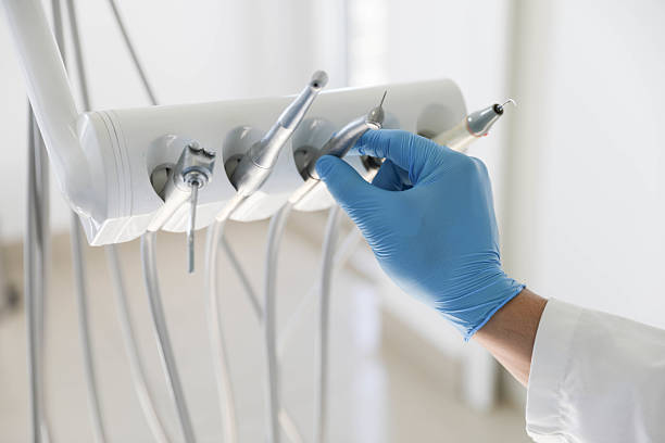 Professional Tooth Extraction technician working in Tamiami, FL